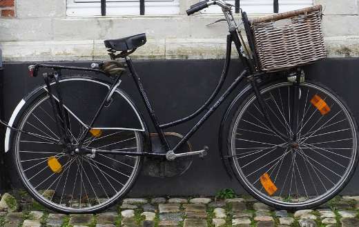 Old black bicycle with basket