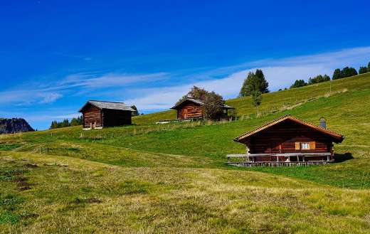 Wooden mountain huts alpine