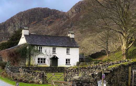 House below mountains