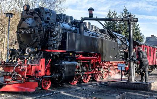 Black and red locomotive steam train
