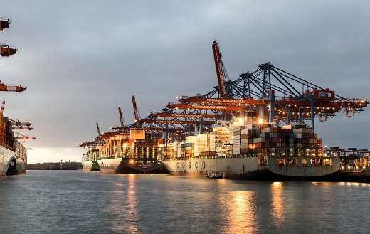 Container ships during night time