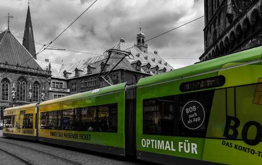 Green color tram on the go