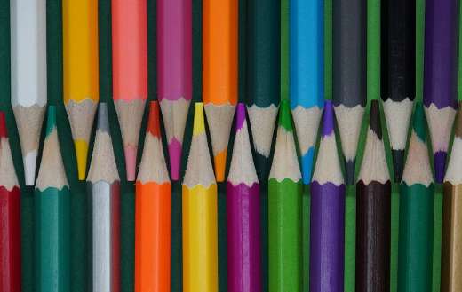 Colored pencils dark green background