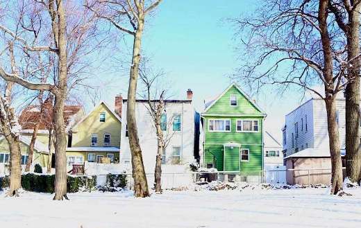Houses in line winter landscape