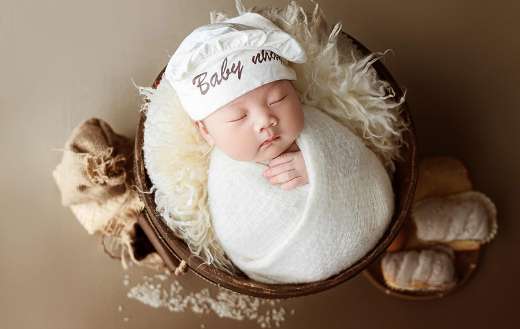 New born photography inside round thing