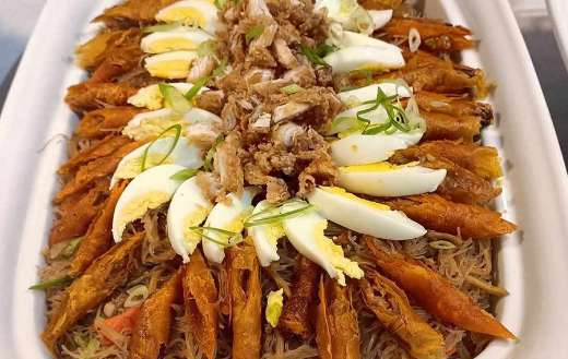 Yummy pancit with lumpia and eggs