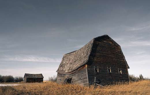 Abandoned old barn start to fall