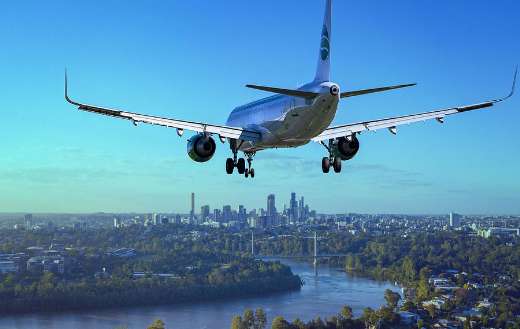 Airplane flight above the city