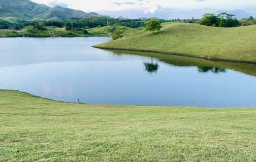 Calm picturesque landscape of lake green hills