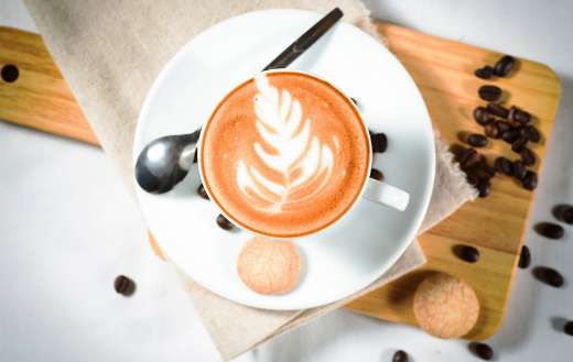 Leaf art cappucino coffee