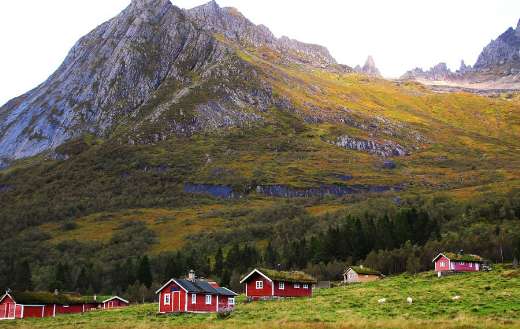 Red houses rocky mountain Norway