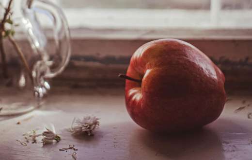 One single red apple