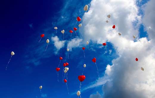 Heart shape balloons floating sky