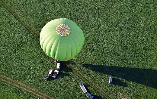 Sky view of green hot air balloon