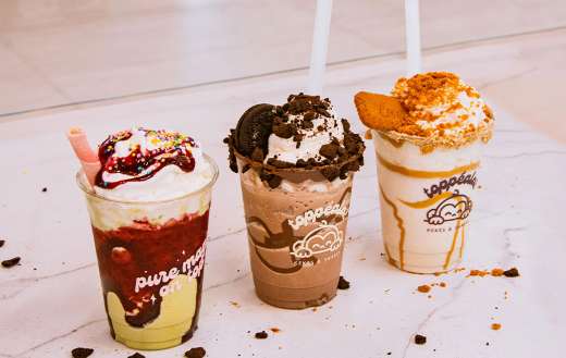 Three decorated milkshakes